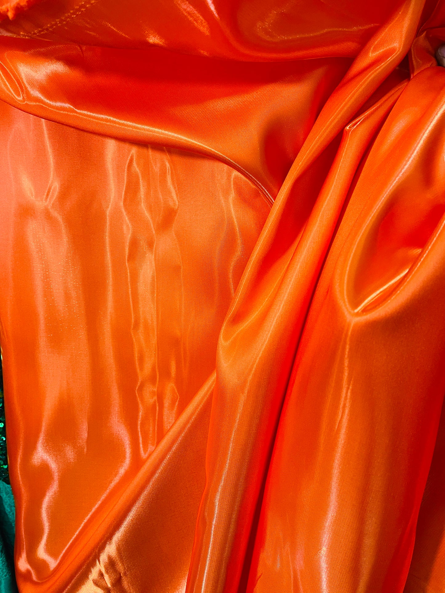 Orange liquid satin great fabric for dress pants jacket skirt shirt and much more