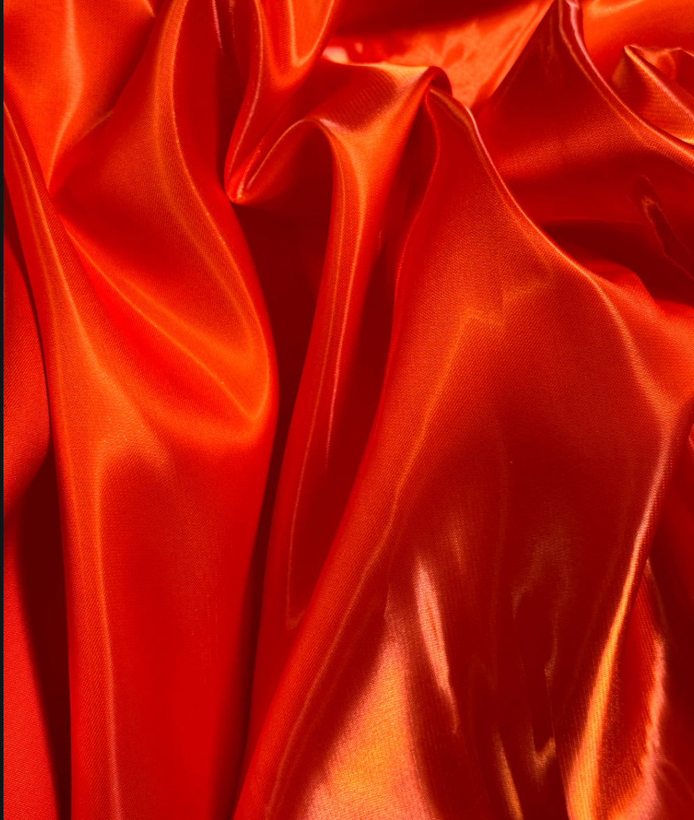 Orange liquid satin great fabric for dress pants jacket skirt shirt and much more