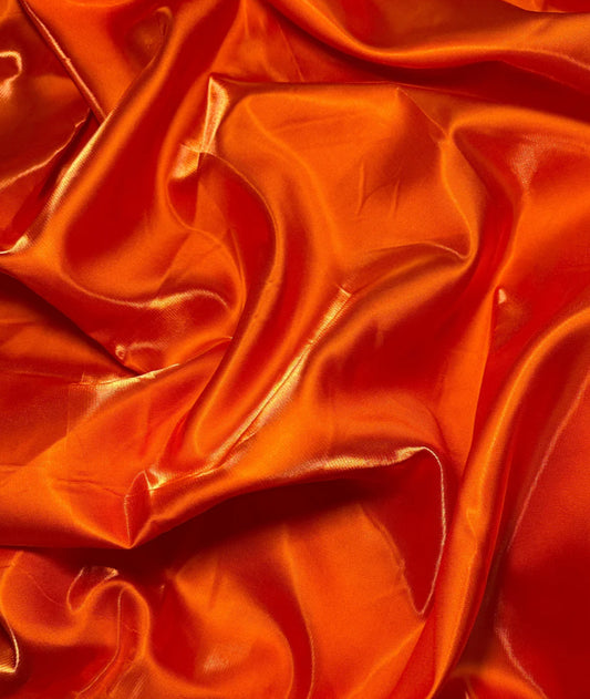 Orange liquid satin great fabric for dress pants jacket skirt shirt and much more